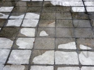 Tiles with water stains showing signs of leaking balconies and poor waterproofing.