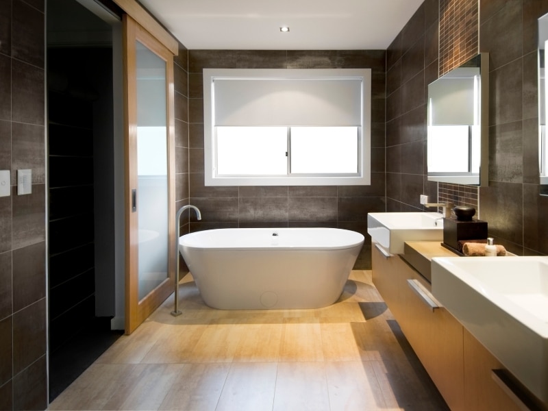 A modern bathroom renovation project, showcasing the process of replacing old tiles with new, stylish ones.