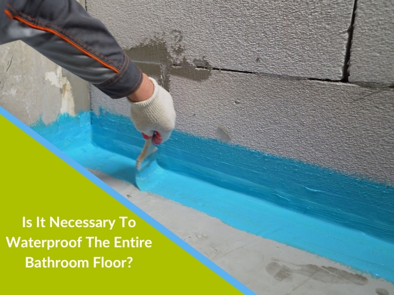 A person applying the waterproofing membrane to a bathroom floor is a crucial step in preventing water damage.