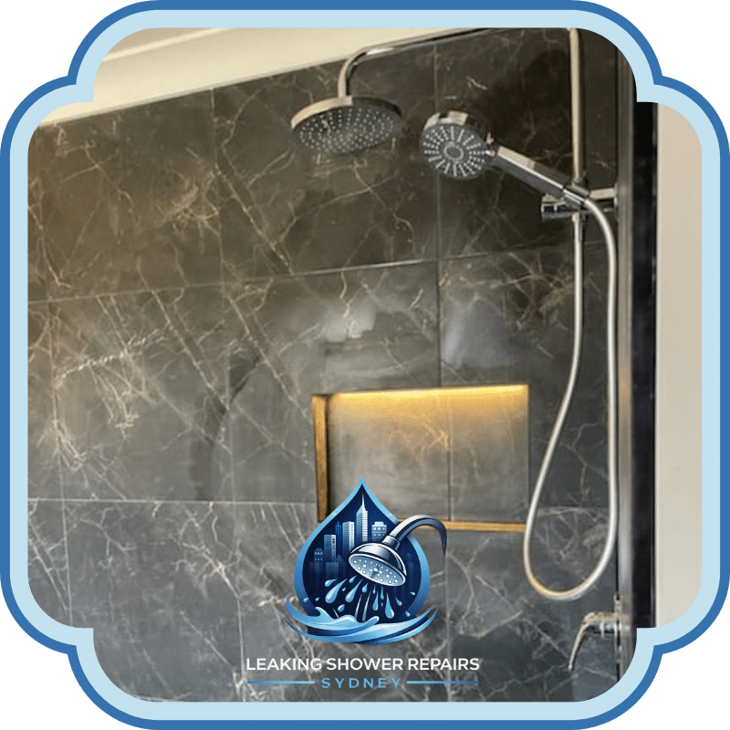 Modern tiled shower with dual shower heads, recessed niche, and waterproofed walls completed under Leaking Bathroom Repairs Services.