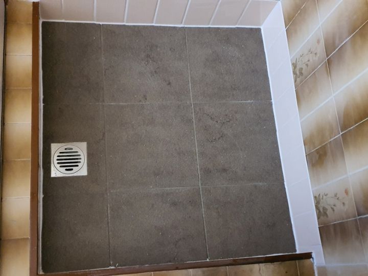 Technician resealing a shower in Campbelltown without removing tiles