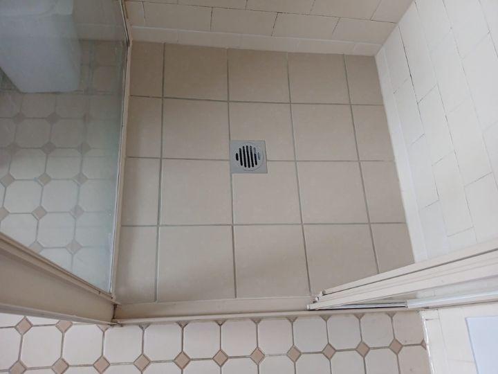 Technician resealing a shower in Canada Bay without removing tiles