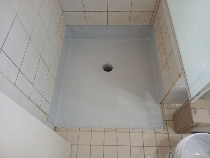 Technician resealing a shower in Fairfield without removing tiles