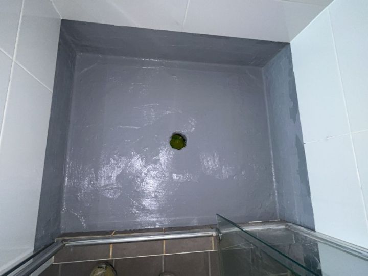 Technician resealing a shower in Penrith without removing tiles