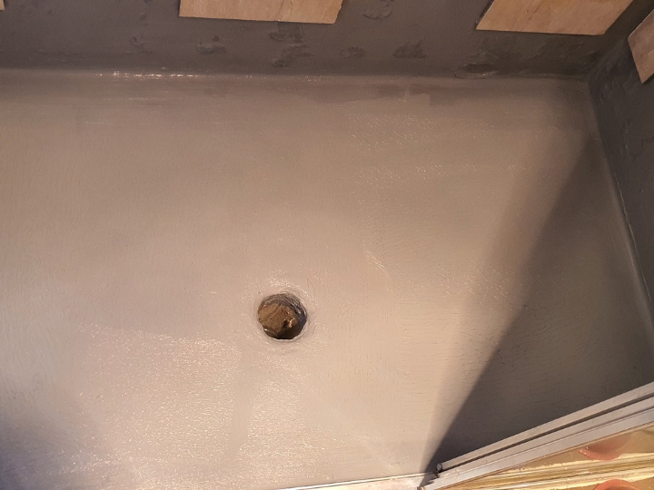 Technician resealing a shower in Sydney CBD without removing tiles